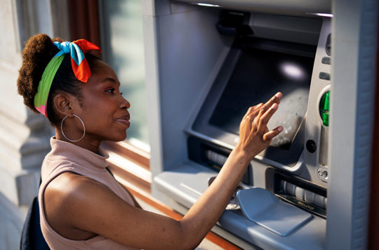 woman using a surcharge free atm