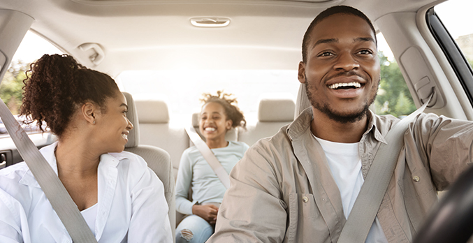 parents driving with child in car