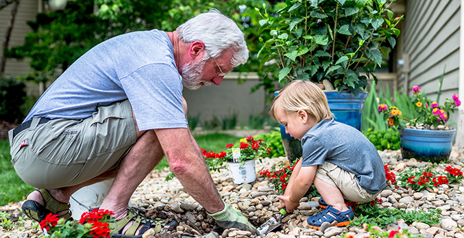 grandfather and child in yard