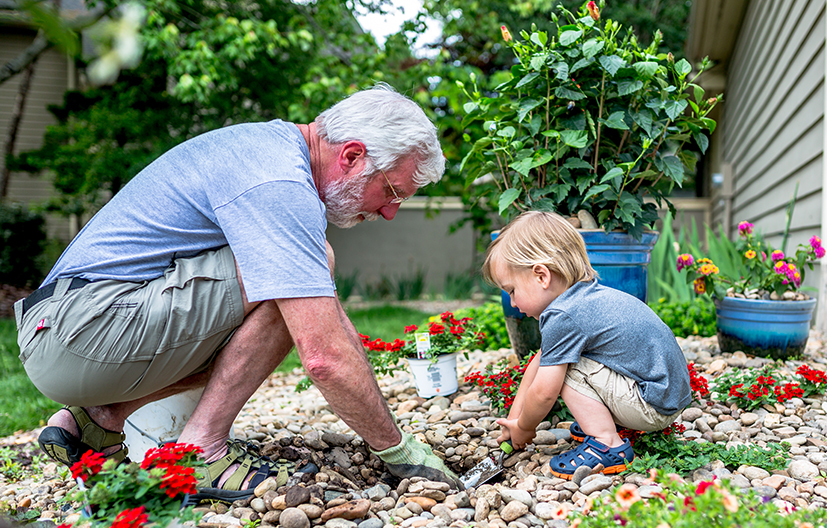 grandfather and child in yard