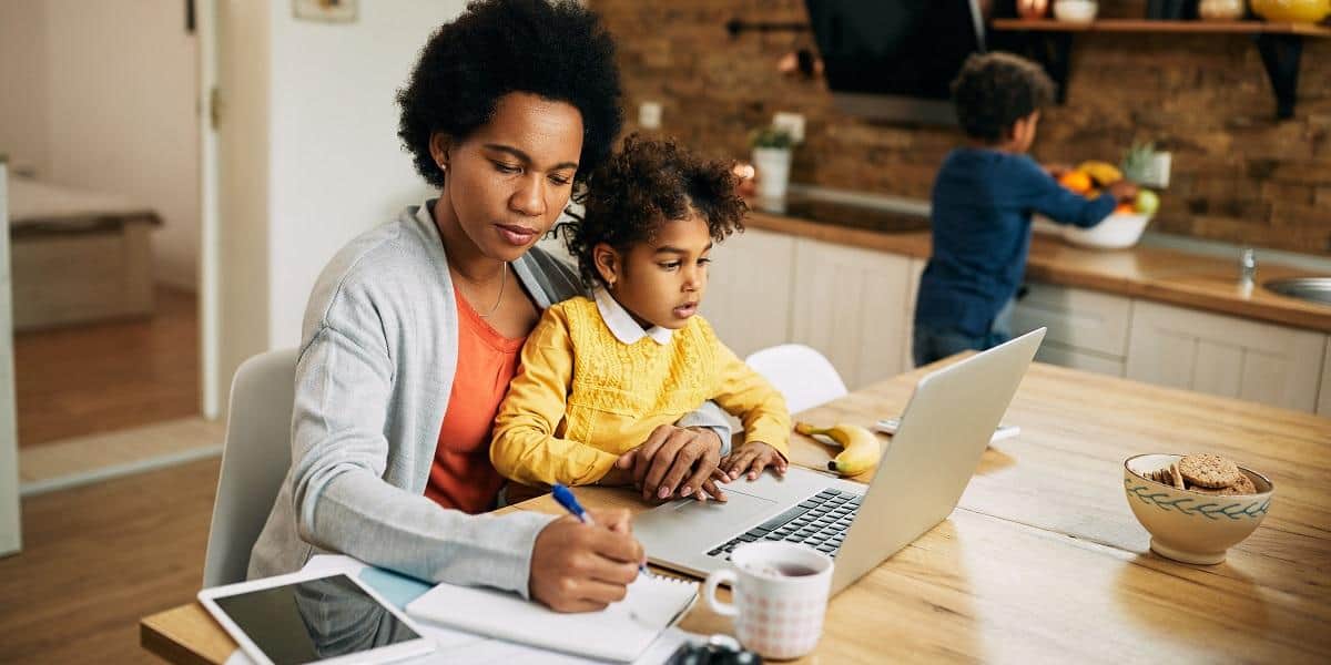 single mother with two kids working at home